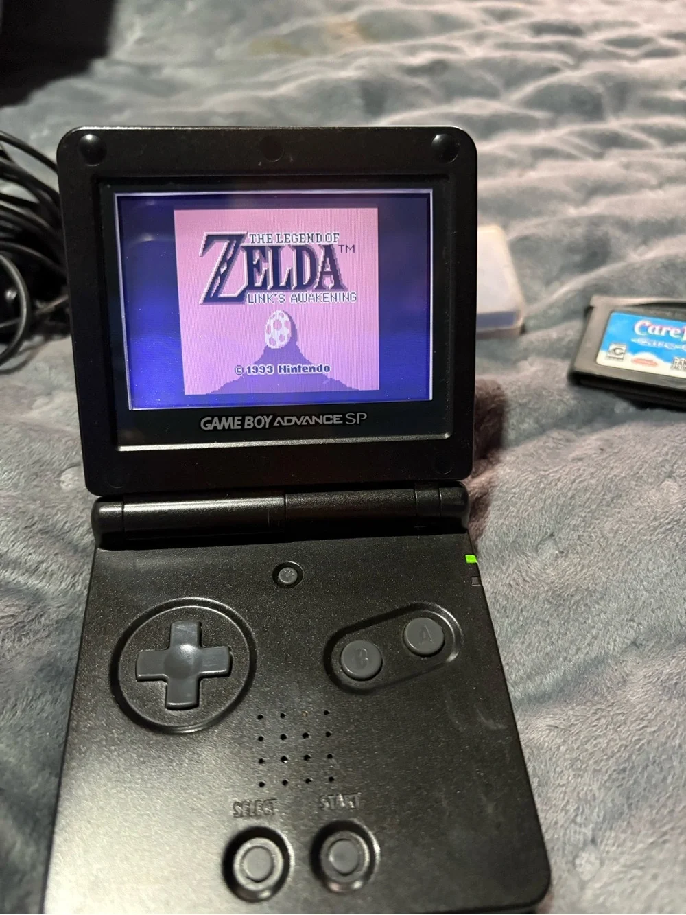 Nintendo Game Boy Advance SP Black with Pokémon sapphire, Zelda, Care Bears